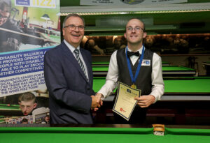 WDBS Chairman Nigel Mawer QPM shakes hands with Daniel Blunn after success at the 2020 Belgian Open