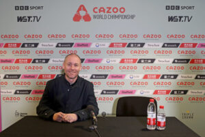 Dave Bolton sits in the Crucible Theatre press conference area during the World Snooker Championship