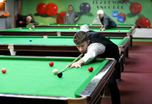 Luke Drennan plays a snooker shot at the Tradewell Snooker Club