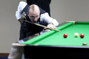 Daniel Blunn plays a snooker shot