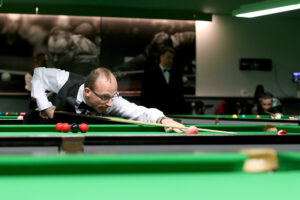 Daniel Blunn plays a shot on the snooker table