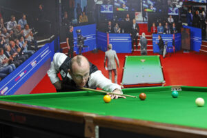 Daniel Blunn plays a snooker shot