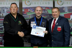 Dave Bolton is presented with his medal and certificate in Ireland