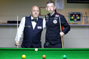 Nigel Brasier and David Church pose by the table before their final