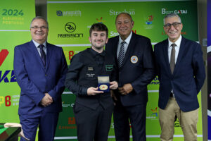 Luke Drennan is presented with his winner's medal at the European Disability Snooker Championship