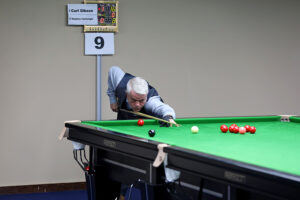 Carl Gibson plays a snooker shot