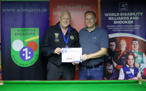 Mike Gillespie receives his certificate at the 2024 German Open