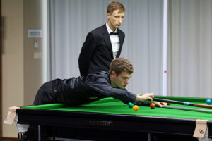 Matthew Haslam plays a snooker shot