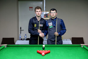 Matthew Haslam and Leroy Williams shake hands before their final