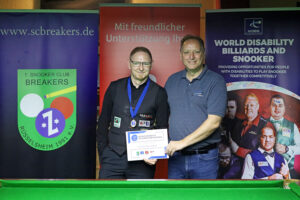 Hannes Hermsdorf receives his medal and certificate after victory in Germany