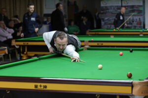 Colvin O'Brien plays a snooker shot