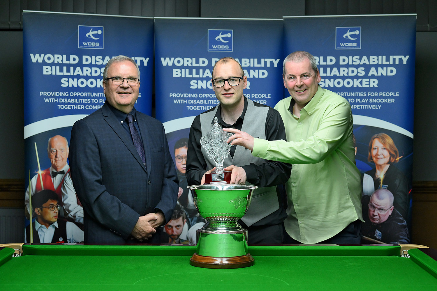 Alan Reynolds smiling with dad and Nigel Mawer