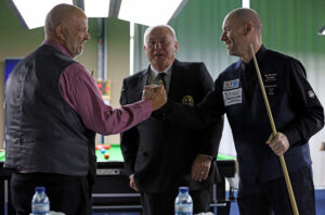 Dave Waller and Dave Bolton shake hands after their group stage match won by Waller